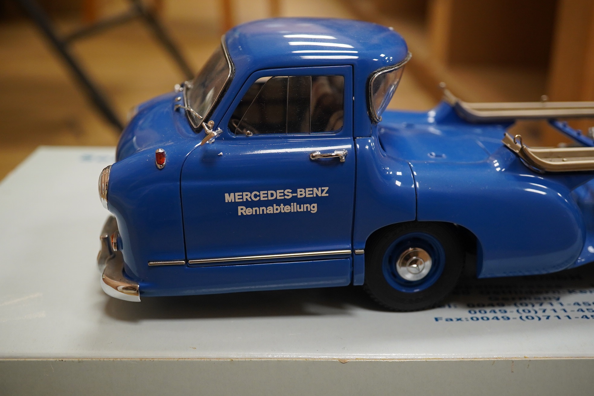 A boxed CMC 1:18 scale diecast model of a Mercedes-Benz 1954 racing car transporter. Condition - good.